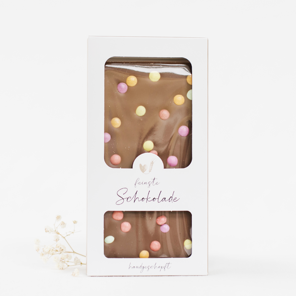 Mjölkchoklad - med färgglada chokladknappar